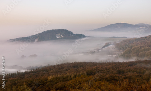 Foggy morning in Ceske Stredohori, Czech Republic photo