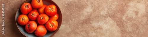 Fresh red tomatoes arranged in a bowl on a rustic table, perfect for healthy cooking and vibrant meal preparation, background with copy space