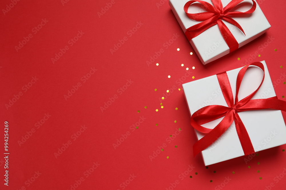 Beautiful gift boxes with confetti on a colored background Beautiful gift boxes with confetti on a colored background