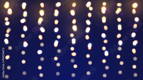 Christmas bokeh on dark navy background. Vertical garland lights
