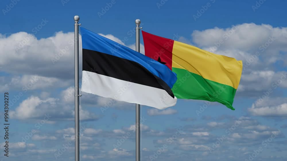 Guinea-Bissau and Estonia flags flying together, video concept of the relationship, two country relations concept Guinea-Bissau and Estonia flags flying together, video concept of the relationship, two country relations concept