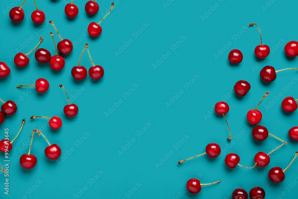 Many red sweet cherries on blue background Many red sweet cherries on blue background