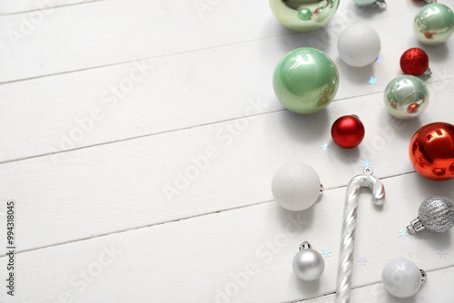 Different Christmas decorations on white wooden background