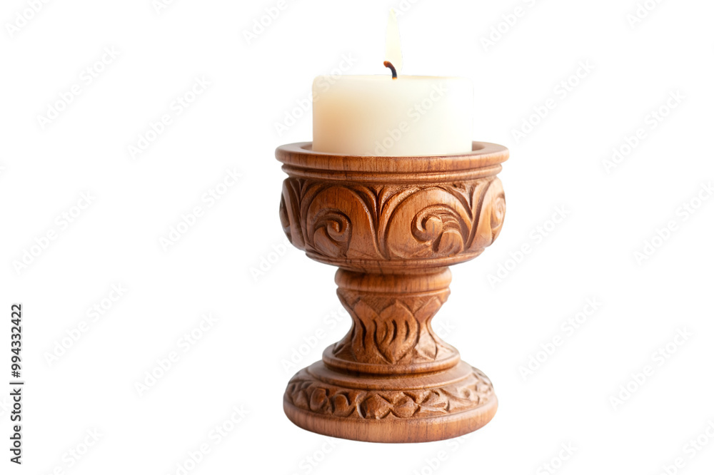 a candle in a wooden holder. a candle in a wooden holder.