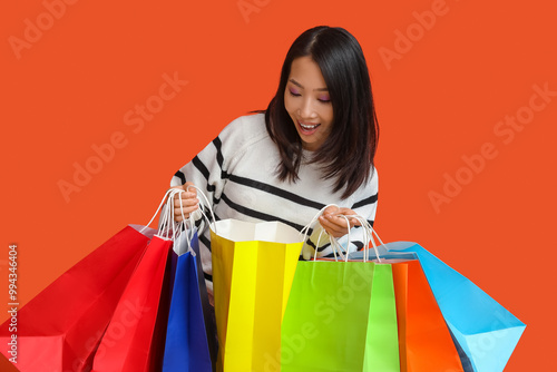 Young Asian woman with shop...