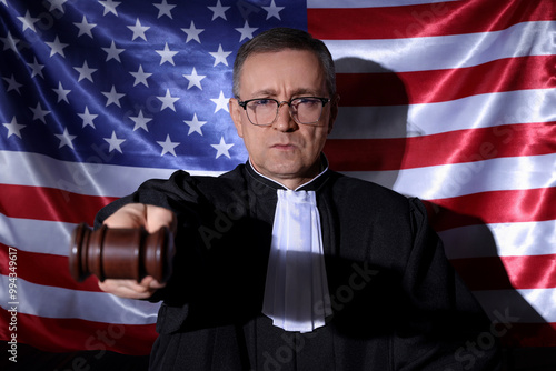 Mature judge with gavel aga...