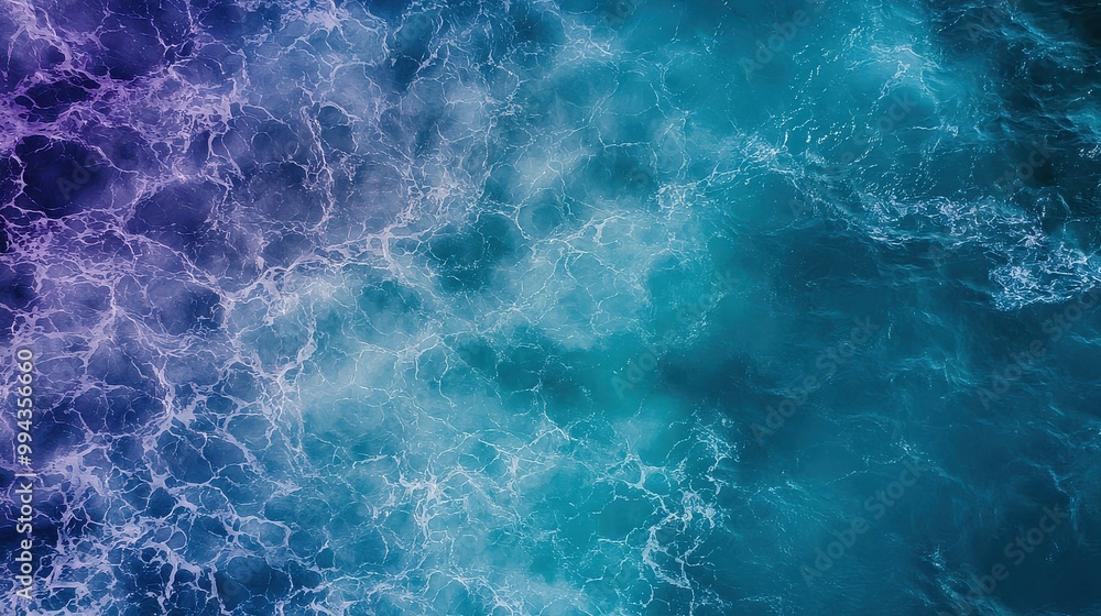 The image is of a body of water with a blue and purple hue. The water appears to be calm and peaceful, with no visible waves or ripples. The colors of the water create a serene and tranquil atmosphere The image is of a body of water with a blue and purple hue. The water appears to be calm and peaceful, with no visible waves or ripples. The colors of the water create a serene and tranquil atmosphere