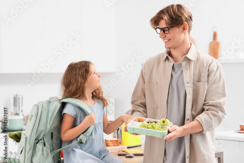 Father with school lunchbox...