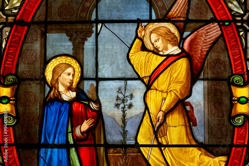 Stained glass of Annunciation to the Blessed Virgin Mary by the Archangel Gabriel. photo