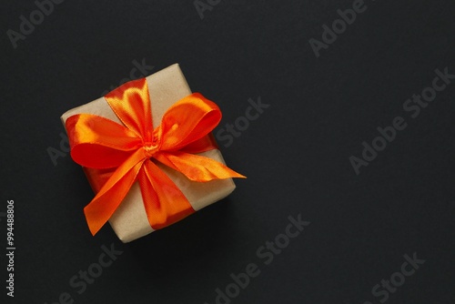 Halloween holiday decorations including gift box, pumpkins, spiders, bats on color background