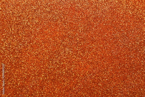 Shiny orange glitter texture background