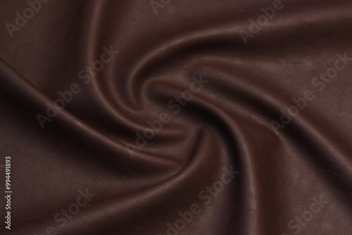 brown artificial leather with waves and folds on PVC base