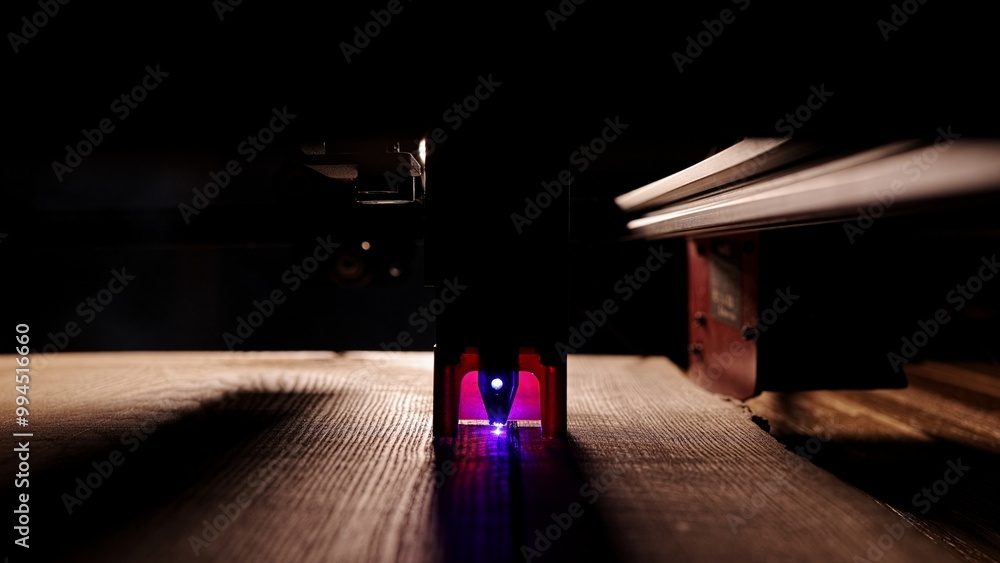 The process of laser wood cutting. A laser machine precisely carves lines on the surface, creating detailed and accurate designs. Perfect for themes of high-tech and manufacturing The process of laser wood cutting. A laser machine precisely carves lines on the surface, creating detailed and accurate designs. Perfect for themes of high-tech and manufacturing