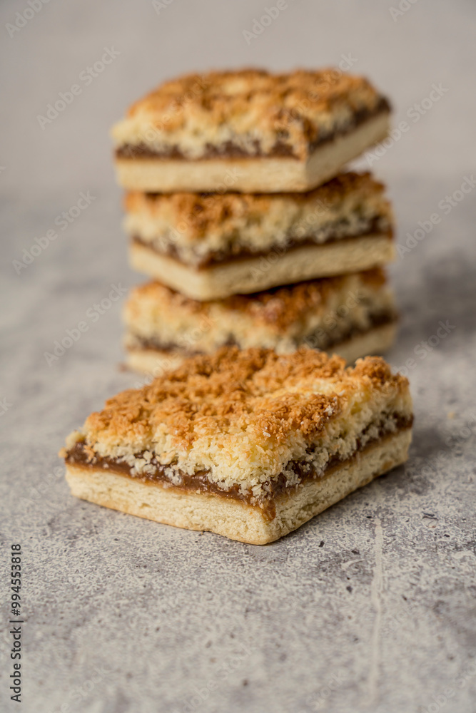 coconut and dulce de leche cookie gray background coconut and dulce de leche cookie gray background