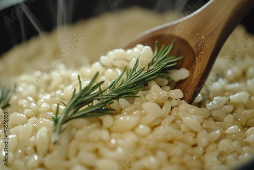 Served with a wooden spoon, fresh off the stove, rice is cooked in a skillet photo