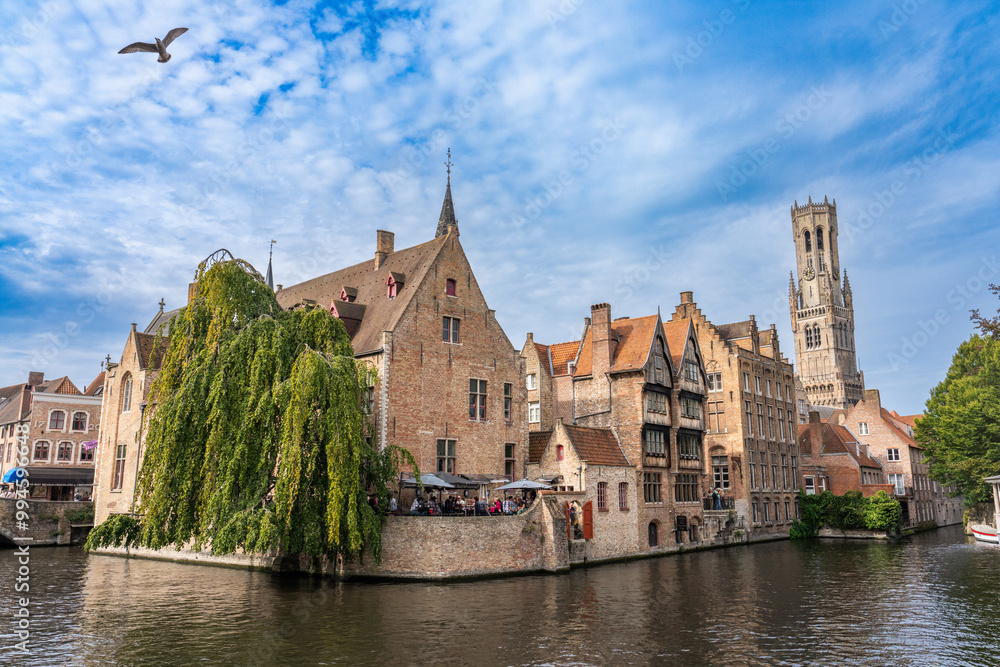 Fototapeta premium Belfort van Brugge and medieval buildings on the Dijver canal from Rozenhoedkaai at dawn.