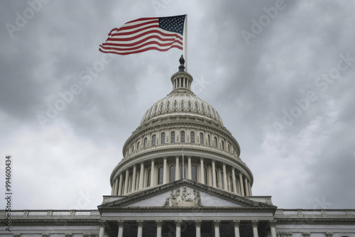 The American flag is flying high above the Capitol building. The sky is cloudy and the building is large and imposing