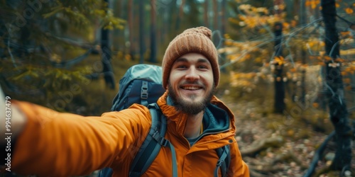 Young person enjoying a vacation in the woods, making a perfect sign during a video call, while live streaming their hiking adventure on social media