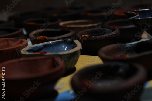 Artistic homemade clay oil lamps or karthikai deepam are ready for diwali and karthikai festivals