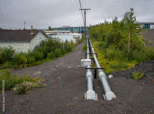 Above ground utility lines over the permafrost of Inuvik, Northwest Territories, Canada photo