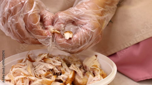 Female Hand Making Ayam Suwir photo