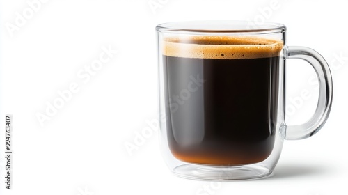 Close-up of a clear glass coffee mug filled with dark coffee.