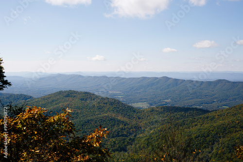 Expansive Mountain Range View Under A Clear Blue Sky