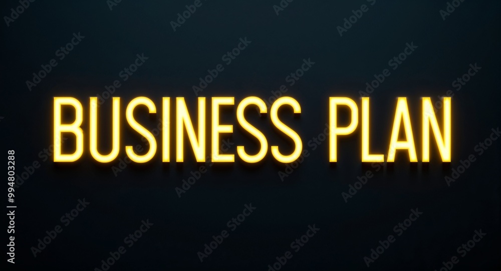 business plan word lettering with yellow glow on plain black dark background business plan word lettering with yellow glow on plain black dark background