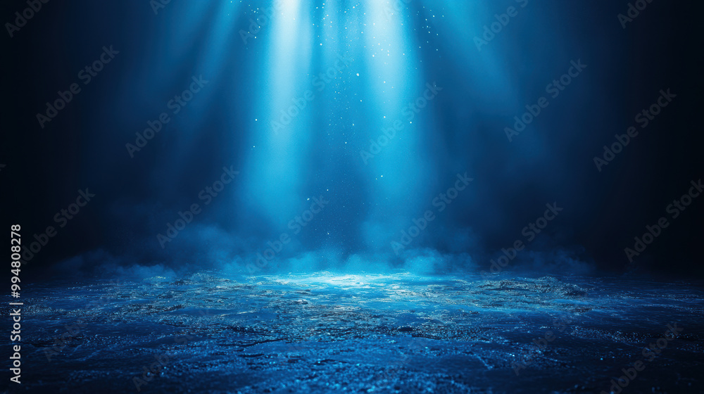 Obraz premium serene underwater scene illuminated by glowing blue light, creating tranquil atmosphere with shimmering water and soft mist. light beams enhance ethereal beauty of depths