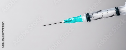 Macro shot of a needle piercing the skin, pain, medical injection discomfort
