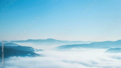 Blue_sky_with_landscape_in_fog