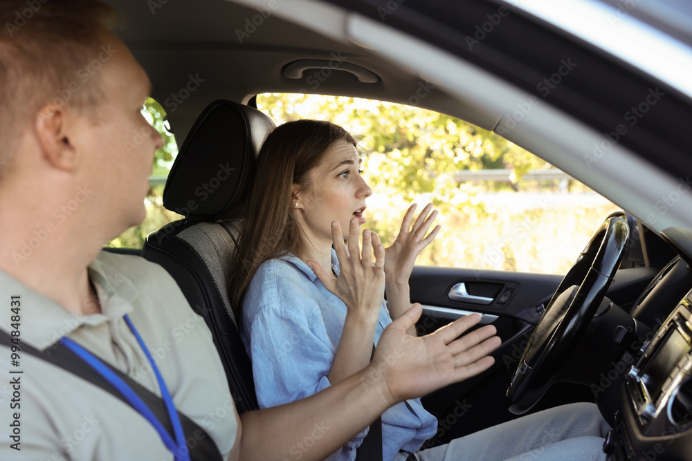 Driving school. Emotional woman having driving lesson Driving school. Emotional woman having driving lesson