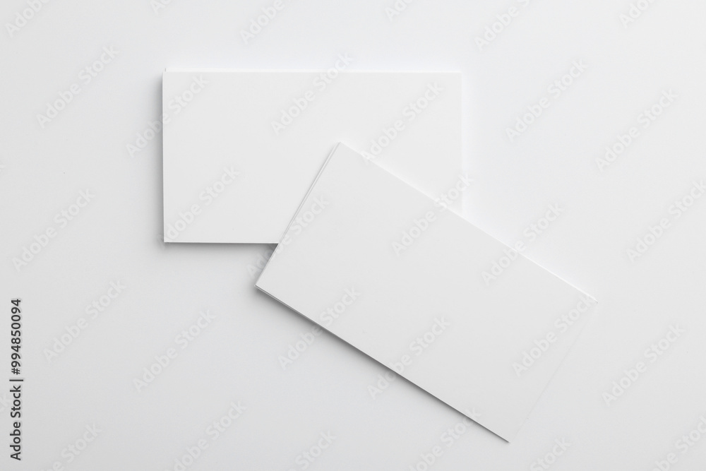 Blank business cards on light grey background, top view. Mockup for design Blank business cards on light grey background, top view. Mockup for design