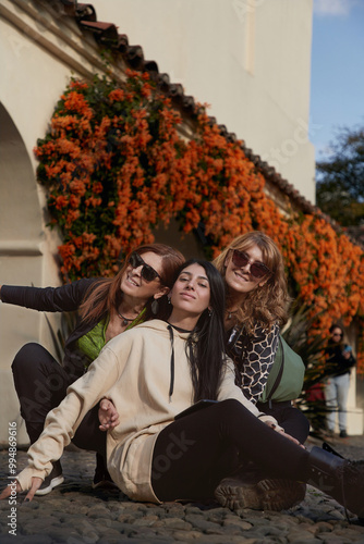 three women in Salta's city Argentina sitting in the courtyard of the Northern Historical Museum; Cabildo de Salta.