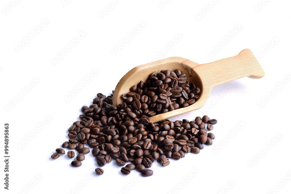 Fresh coffee beans in a wooden spoon. Fresh coffee beans in a wooden spoon.
