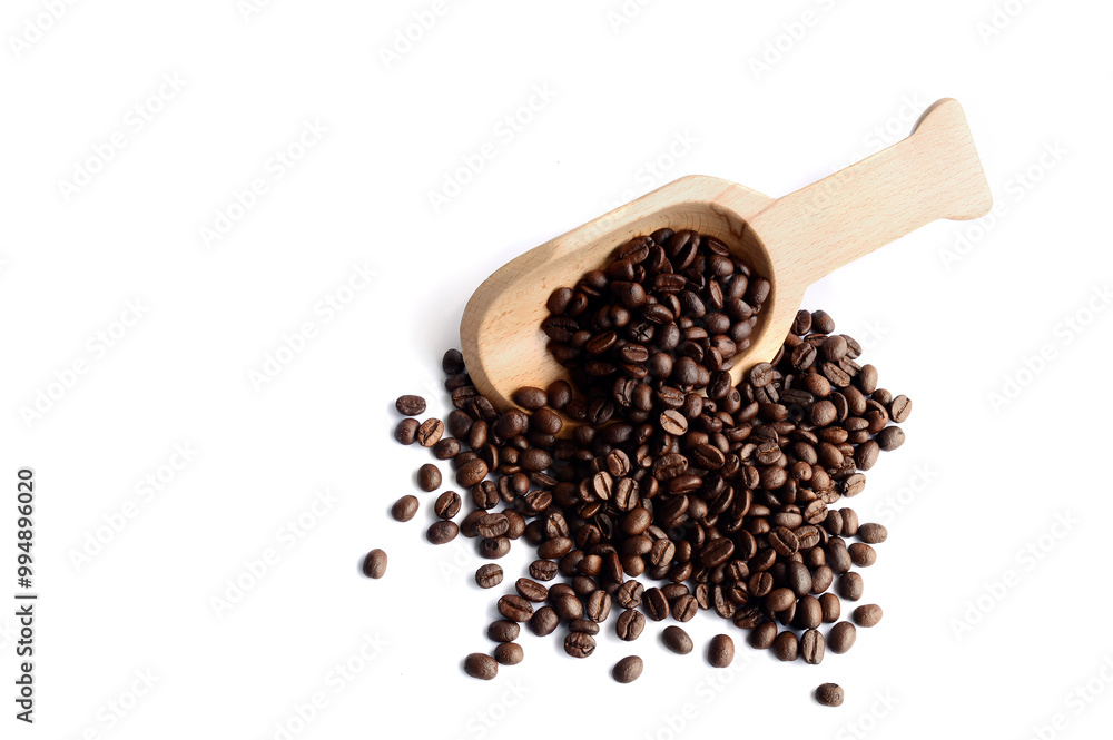 Fresh coffee beans in a wooden spoon. Fresh coffee beans in a wooden spoon.