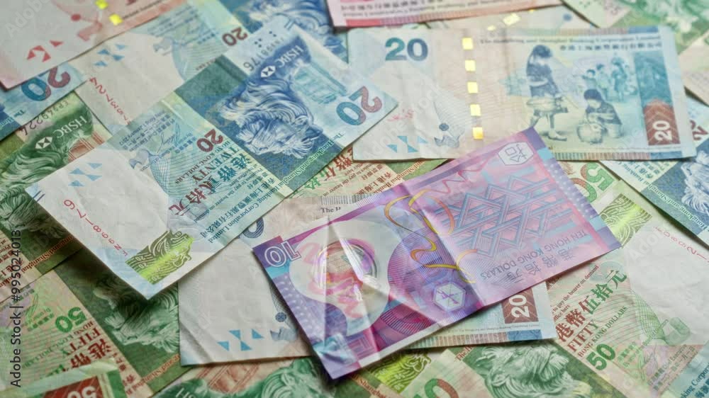 Colorful spread of hong kong dollar banknotes showcasing different denominations in a vibrant, scattered arrangement without any people present. Colorful spread of hong kong dollar banknotes showcasing different denominations in a vibrant, scattered arrangement without any people present.