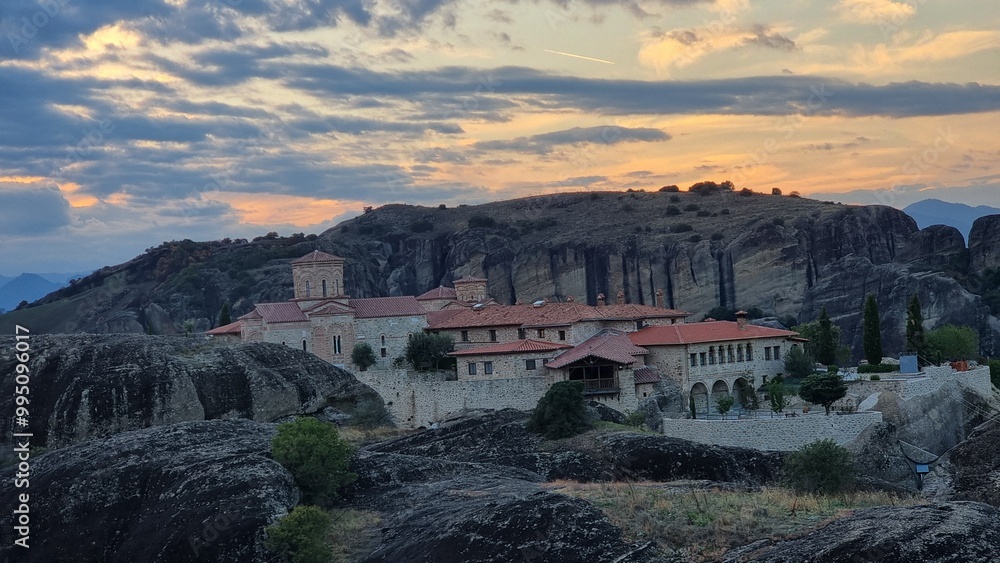 Fototapeta premium meteora churches in kalampaka city greece sunset time
