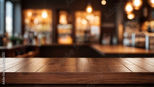 empty wooden brown table top on the background of a blurred bar