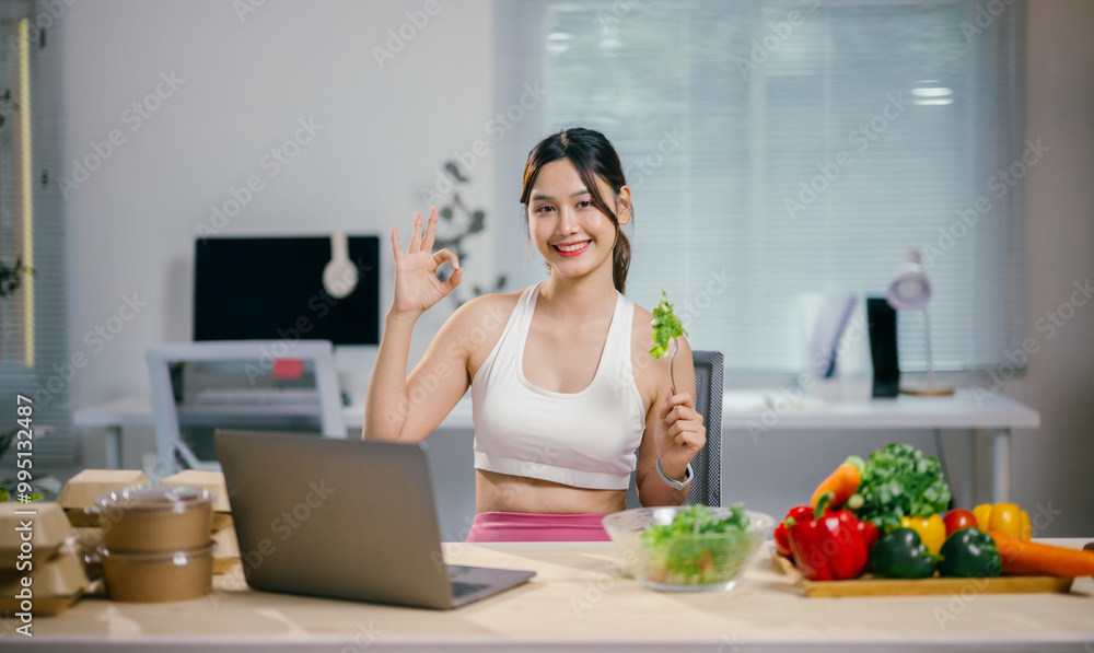 Young woman happily eats a healthy salad while working from her home office, exuding confidence and positivity Young woman happily eats a healthy salad while working from her home office, exuding confidence and positivity