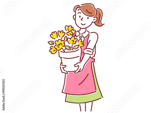 花が咲いた植木鉢を持った花屋の若い女性スタッフ