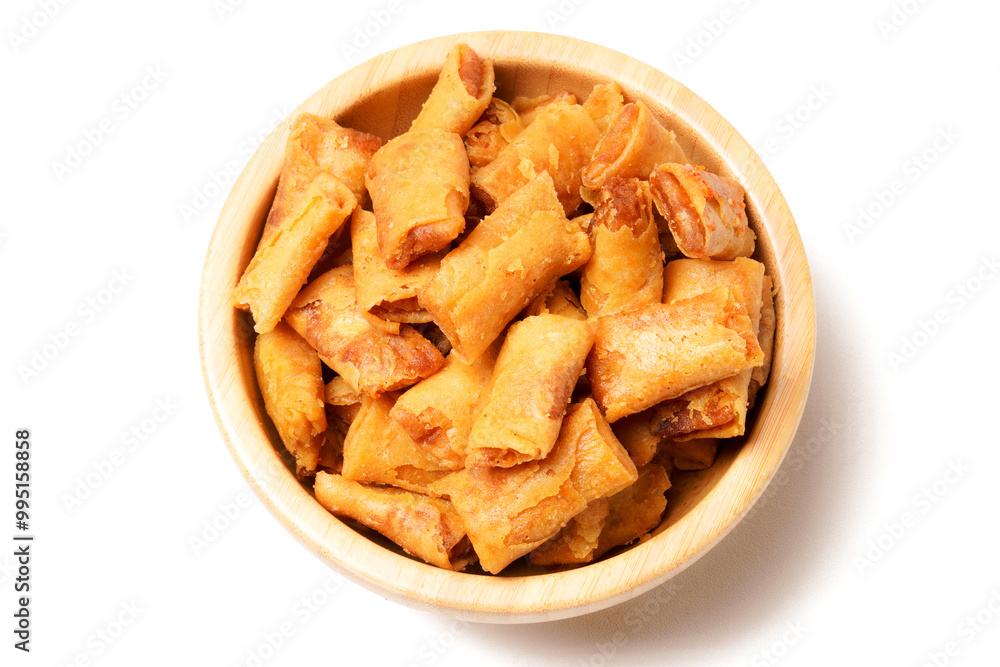 A bowl of Sumpia, Indonesian traditional mini spring rolls filled with shrimp floss. The crunchy outer wrapper is deep-fried to perfection. Photographed on a white background. A bowl of Sumpia, Indonesian traditional mini spring rolls filled with shrimp floss. The crunchy outer wrapper is deep-fried to perfection. Photographed on a white background.