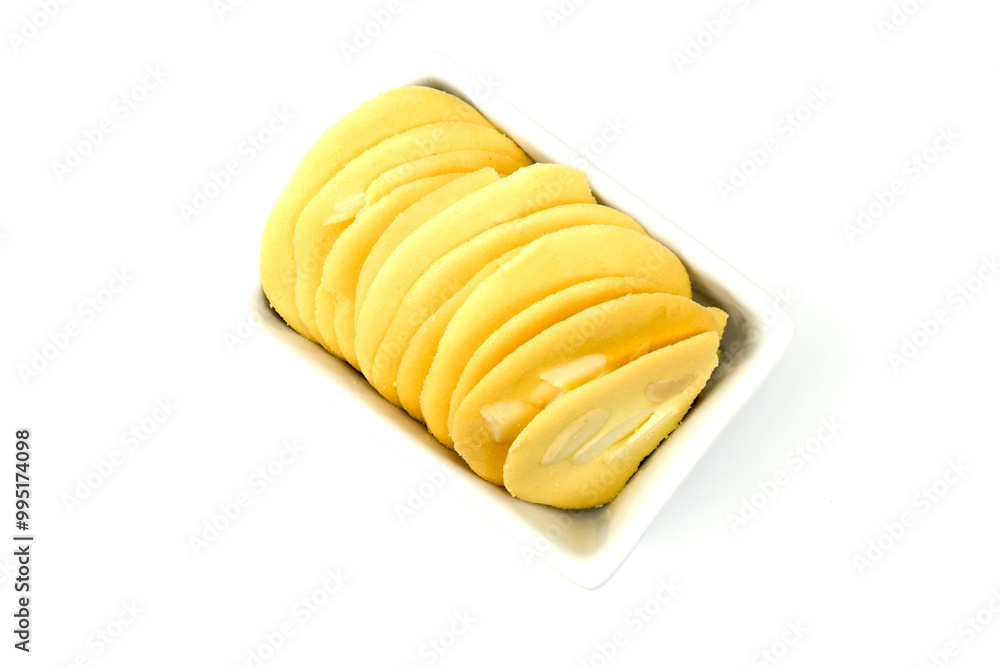Group of almond tuile (tule) cookies in white rectangular cup isolated on white background top view flat lay stacking. Group of almond tuile (tule) cookies in white rectangular cup isolated on white background top view flat lay stacking.