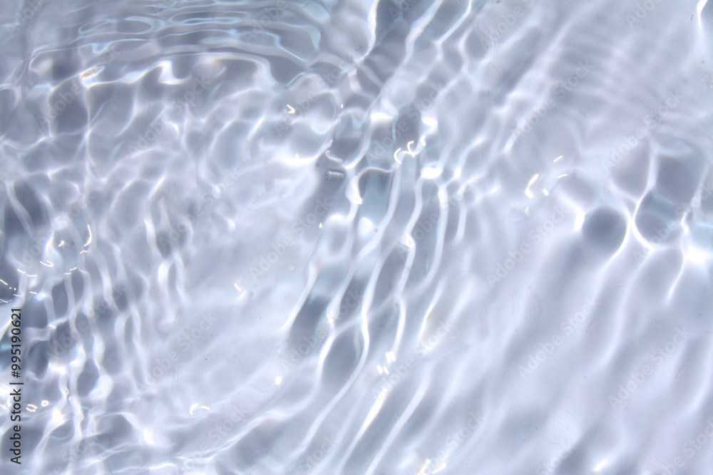 White water with ripples on the surface. Defocus blurred transparent white colored clear calm water surface texture with splashes and bubbles. Water waves with shining pattern texture background. White water with ripples on the surface. Defocus blurred transparent white colored clear calm water surface texture with splashes and bubbles. Water waves with shining pattern texture background.