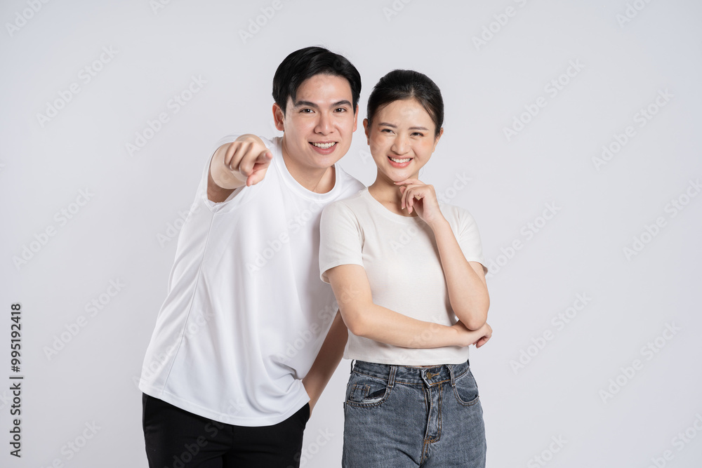 Image of Asian couple posing on white background. Image of Asian couple posing on white background.