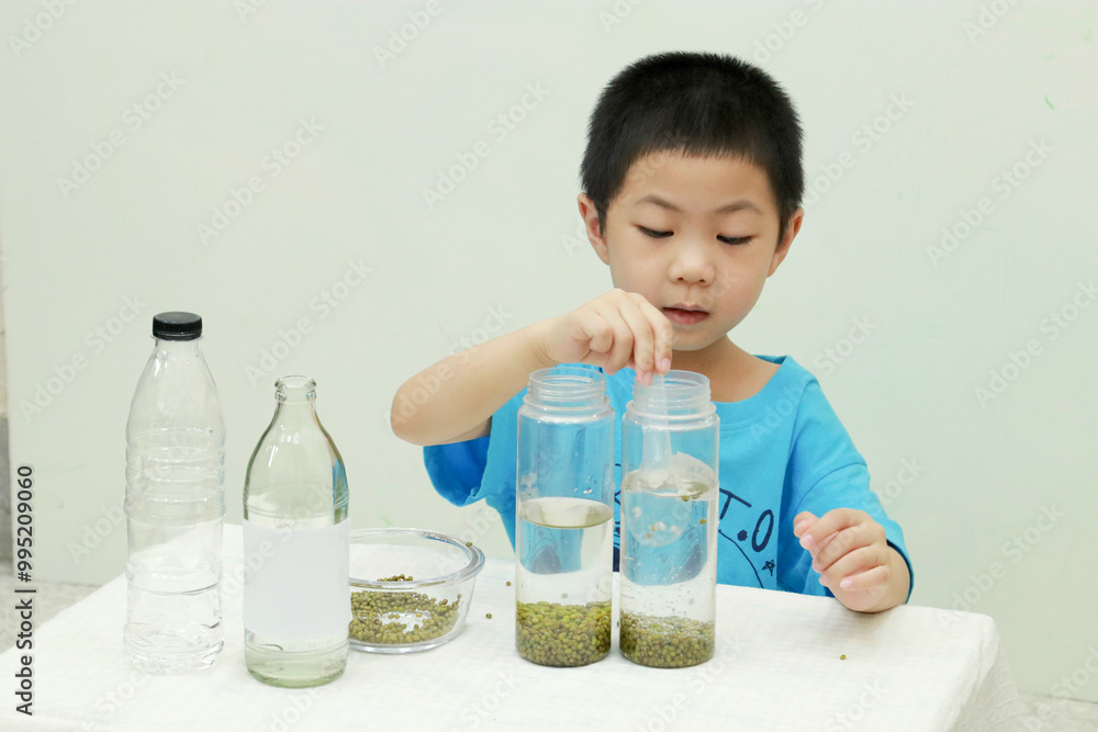 Easy science experiments at home to learn about for kids to learn the properties of carbon dioxide gas is lighter than water. Educational and learning concept for kids through play activities at home. Easy science experiments at home to learn about for kids to learn the properties of carbon dioxide gas is lighter than water. Educational and learning concept for kids through play activities at home.