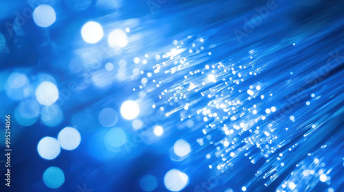 Wallpaper Mural Bright blue light beams and shimmering particles create dynamic visual effect, representing advanced technology and digital transformation. This image captures essence of innovation and connectivity Torontodigital.ca