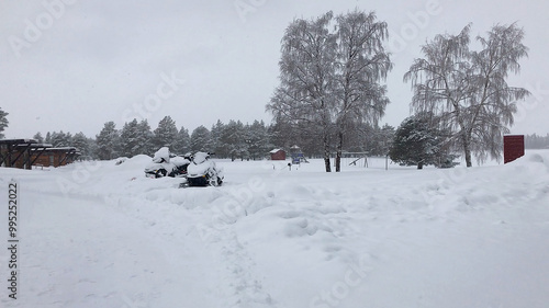 Falling snow covering the area in a blanket of white