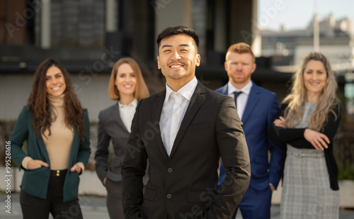 Group of executives and team leader smiling and ready to meet their goals on the successful project