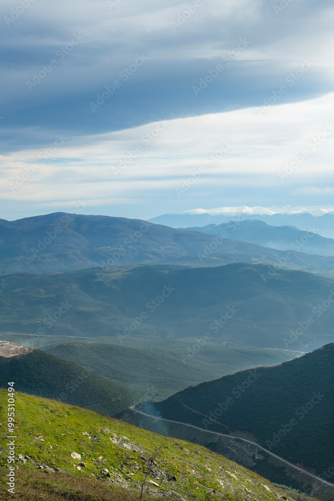 Fototapeta premium Mountain landscape at sunset. View of the mountains from above in the evening. Sunset view of the mountain range. Sunset in the mountains. Bursa trekking routes. Bursa, Türkiye.
